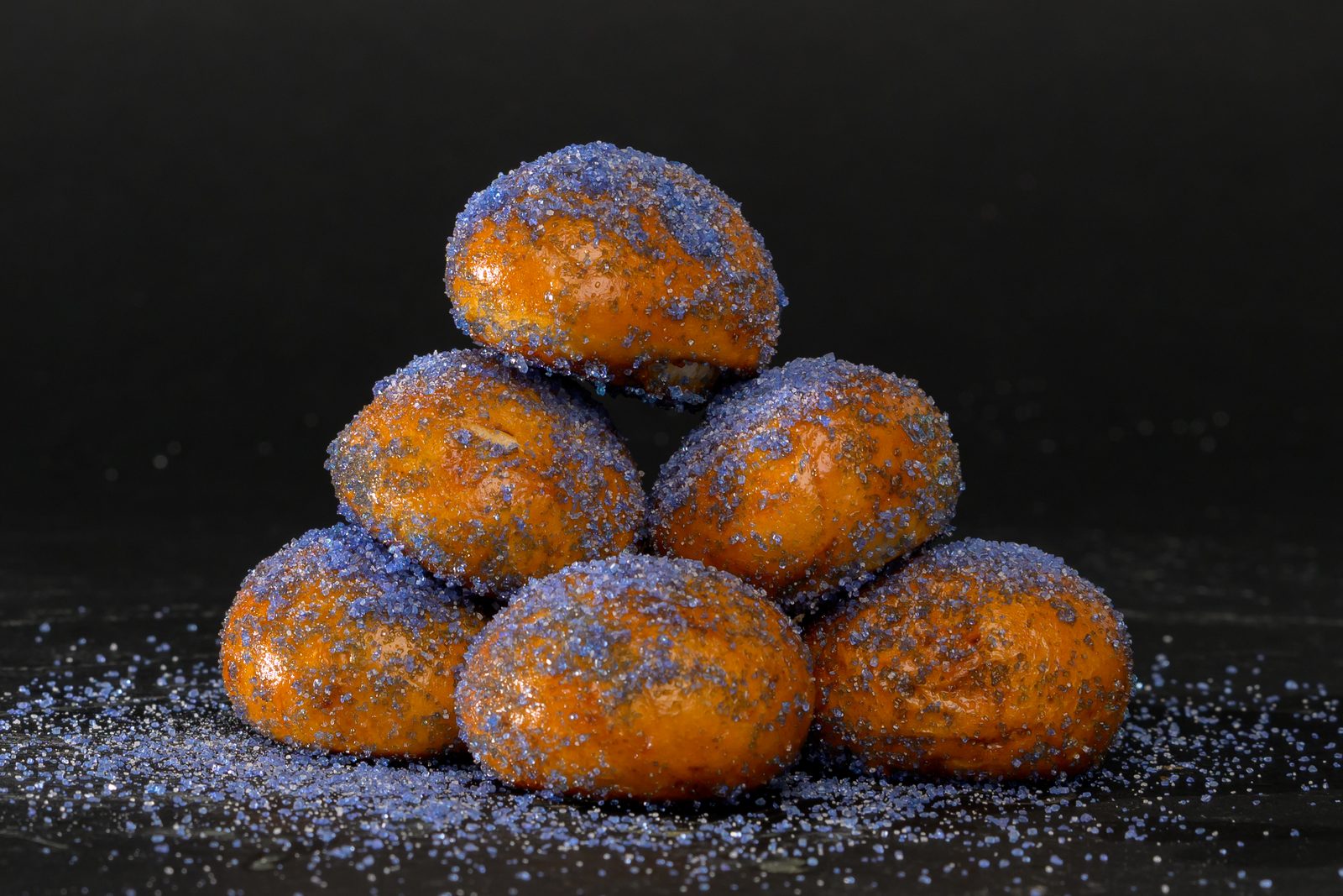 A pyramid of golden pretzel bites dusted in purple sugar