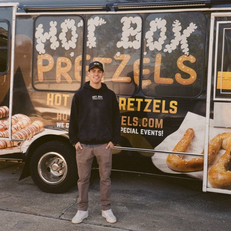 Roman in front of the Hot Box Pretzels food truck